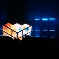 A neon, rainbow-filled stage lit up in the dark.
